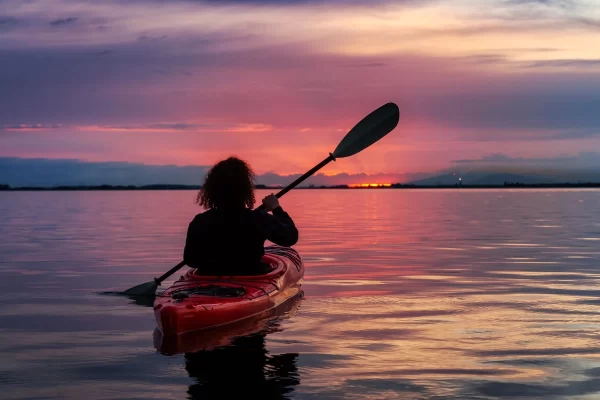 sunset kayak adventure paddler